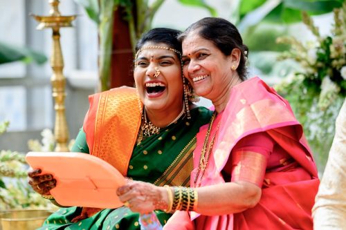 Bride and mother in law laughing together during Laxmi Poojan at Maharashtrian wedding Ambrosia Pune