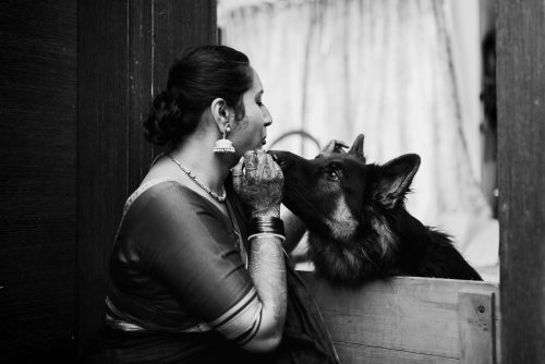 Bride sharing a quiet moment with her dog after intimate Marathi wedding in Pune