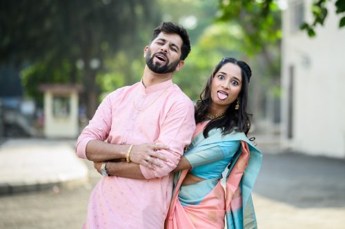 Bride and groom making funny expressions during candid wedding couple portraits Maharashtrian wedding, harshal hall, pune