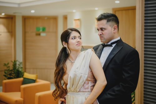 Bride and groom making funny expressions during playful wedding couple portraits