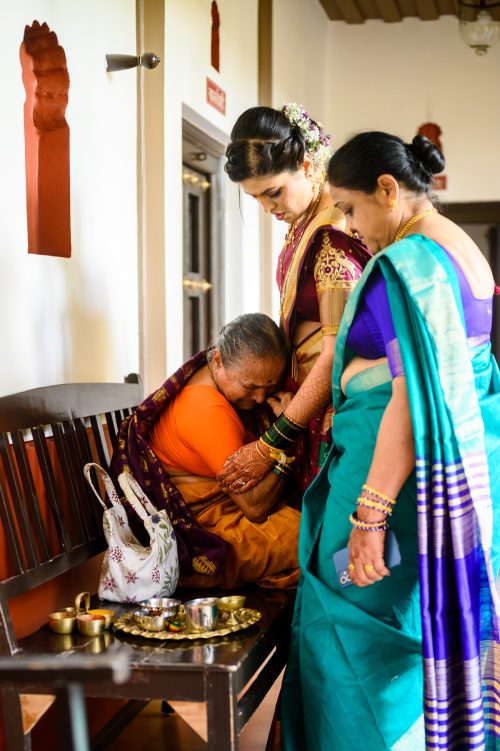 Grandmother hugging bride emotionally during Marathi wedding at Dhepe Wada Pune