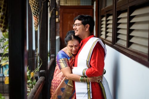 Groom and mother hugging before wedding ceremony at Maharashtrian home wedding in Pune