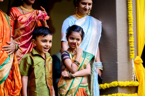 Kids reacting playfully during Marathi wedding ceremony at Dhepe Wada Pune