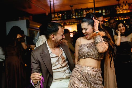 Bride and groom dancing freely during late night cocktail party in Pune wedding