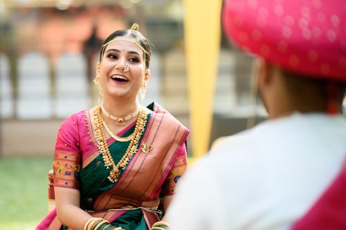 bride smiling at groom during maharashtrian wedding ceremony