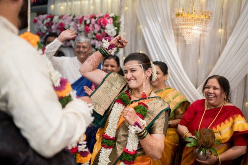 marathi bride celebrating after garland exchange during wedding ceremony