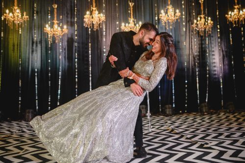 Bride and groom dancing together during sangeet night at Keshavbaug Pune wedding