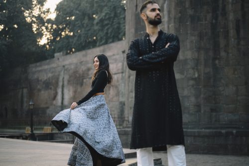 Couple standing apart during stylish pre wedding couple portrait shoot at shanivar wada pune