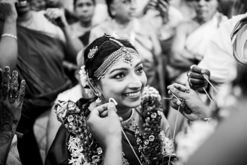 tamil brahmin bride emotionally smiling during tali mangalsutra ceremony