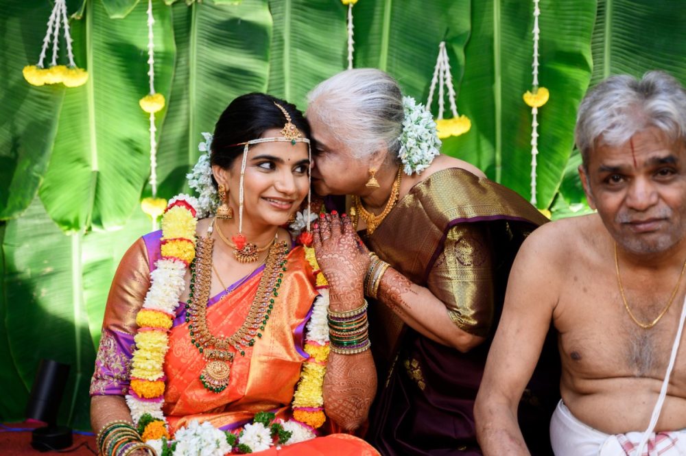 Bride sharing a beautiful moment with her mother during wedding ceremony at Shreyas Banquets Pune