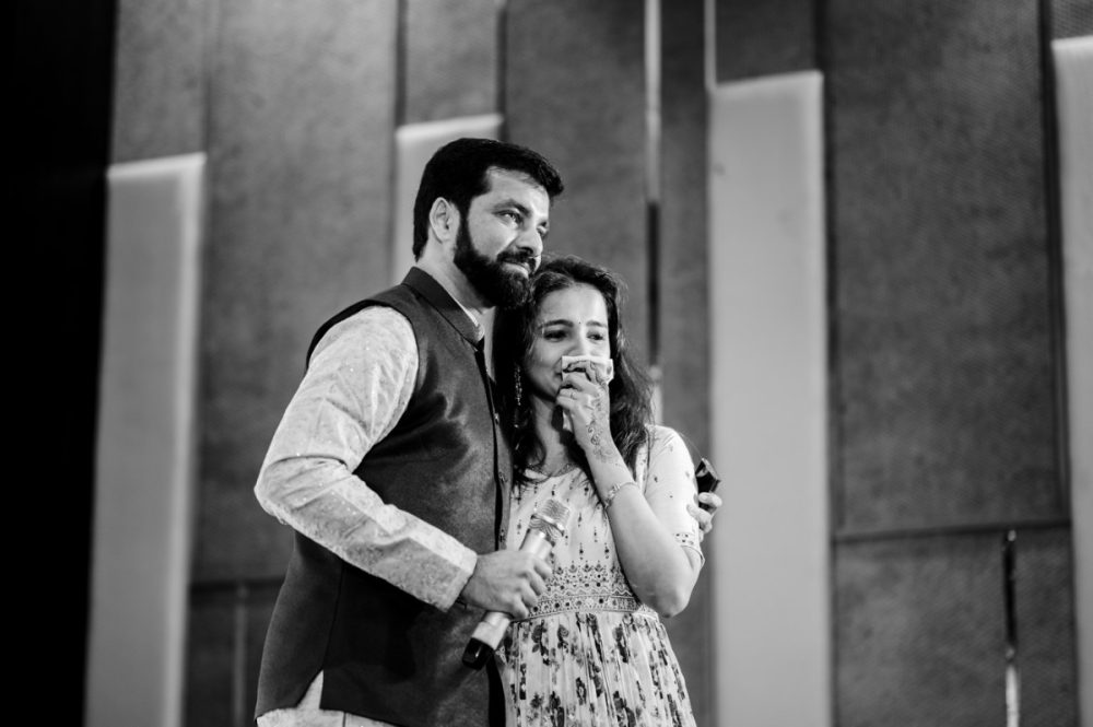 Brother hugging his sister during emotional speech at maharashtrian wedding sangeet ceremony in Pune