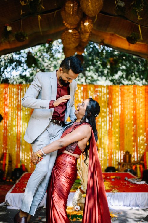 bride lifting groom during tamil wedding reception. funny hilarious moment