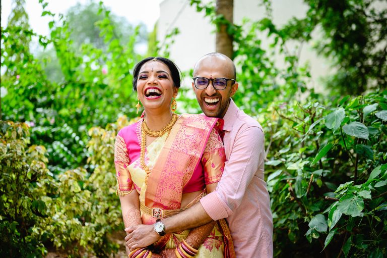 bride and groom hugging and laughing during their photo session at their telugu-kerala style wedding at hyatt regency pune